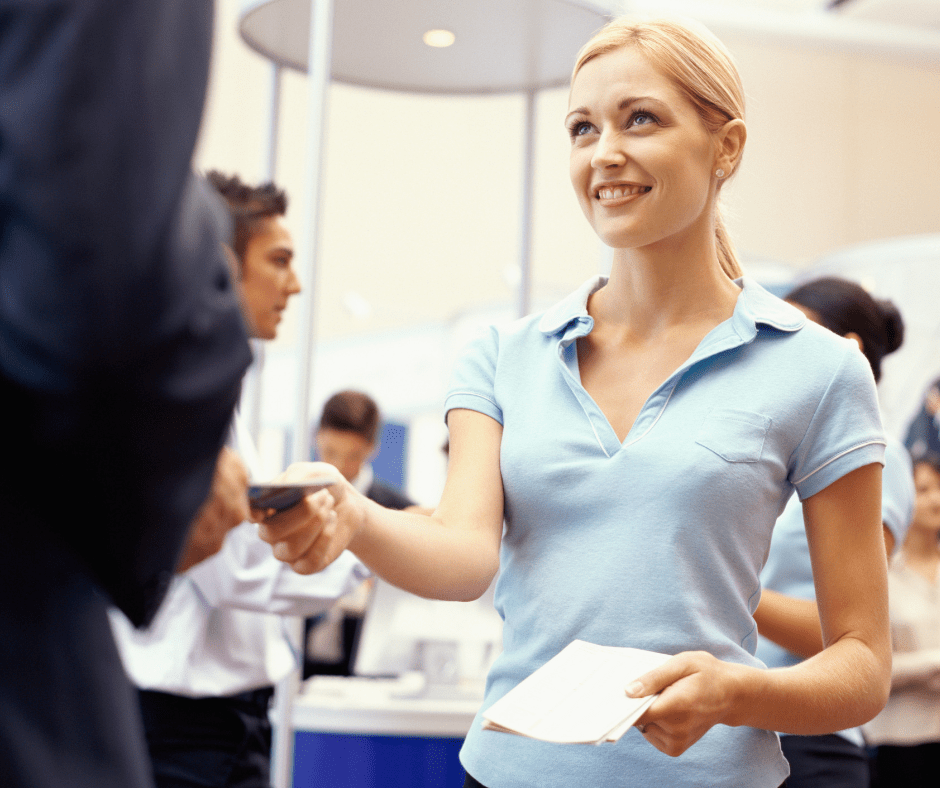 young blonde woman, exhibitor helping